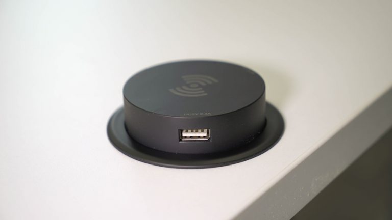 HON-Coordinate-standing-desk_wireless-charging_wireless-and-usb-pop-up-charging-grommet_up-768x432